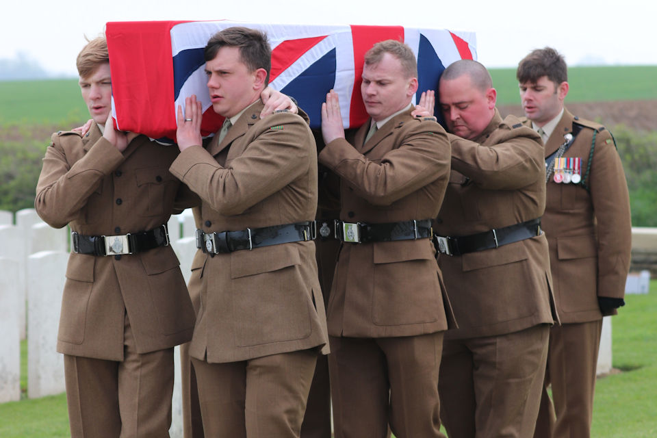 A bearer party from 1 RIFLES carry Private Burt's coffin, Crown Copyright, All rights reserved