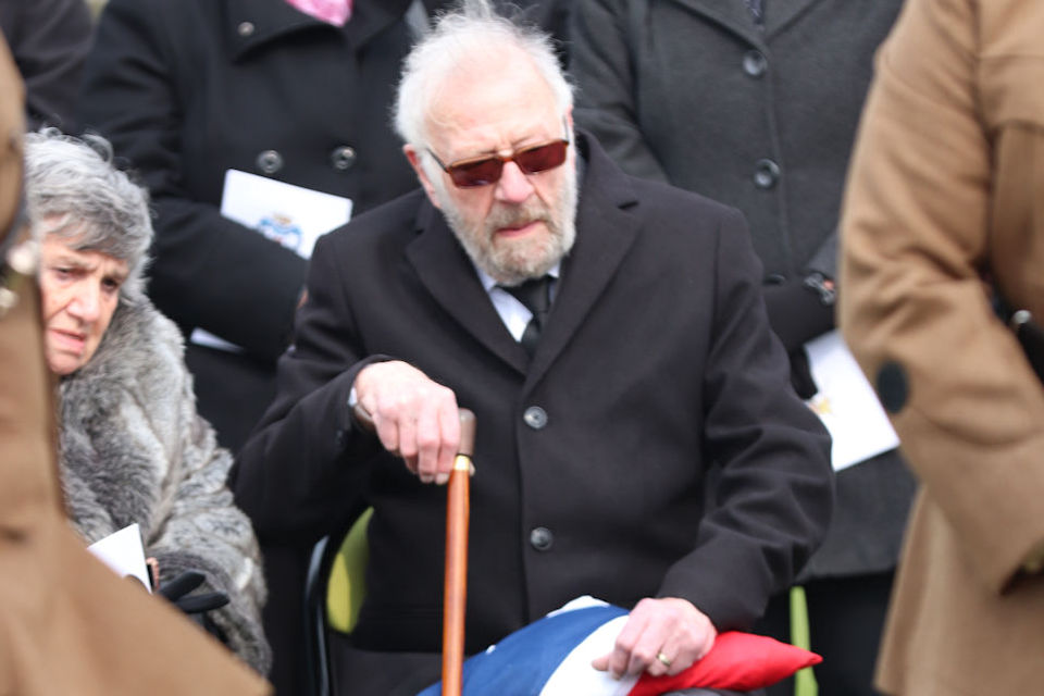 Mr Philip Lean, nephew of Private Burt, surrounded by his family, Crown Copyright, All rights reserved