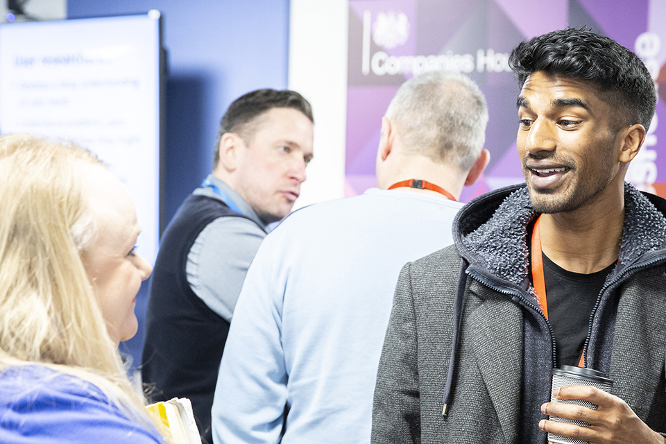 A group of people discuss upcoming jobs at a digital open day