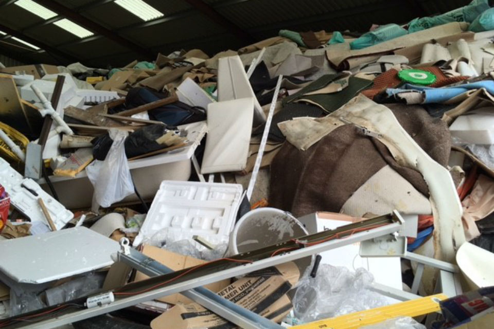 Interior shot of rubbish in warehouse piled up