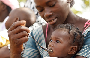 Photograph of a child being fed in Burkina Faso