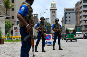 Soldiers take up their positions at a checkpoint on a street in Colombo