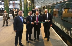 David Mundell, Michael Matheson and Ryan Flaherty cut the ribbon at the launch of the new Caledonian Sleeper service