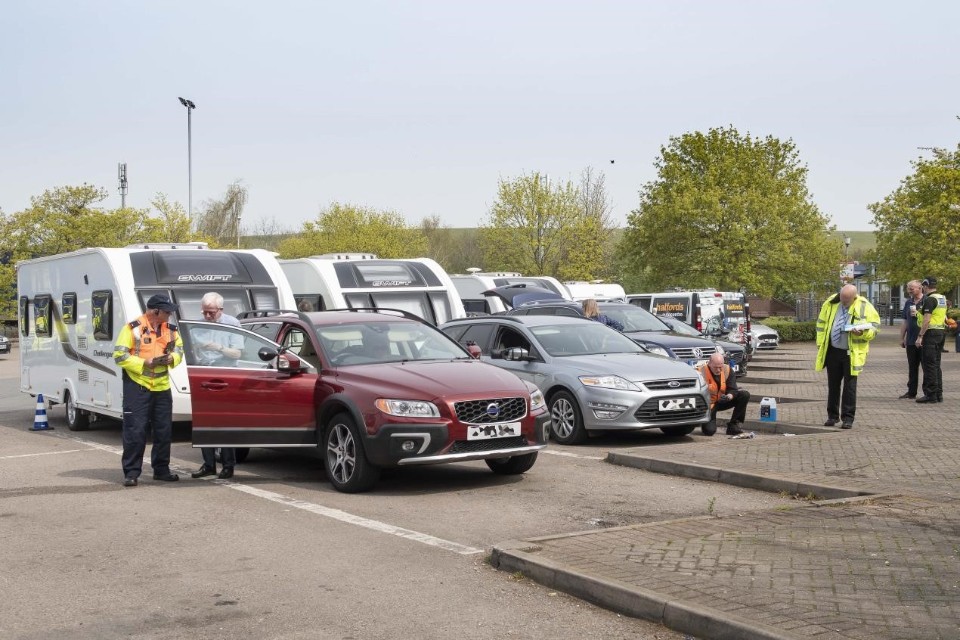 Highways England Traffic Officers give advice to caravanners at an event at the Barn Hill services on the M40 in Warwickshire. 