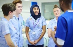 Nurses having a discussion in a hospital.