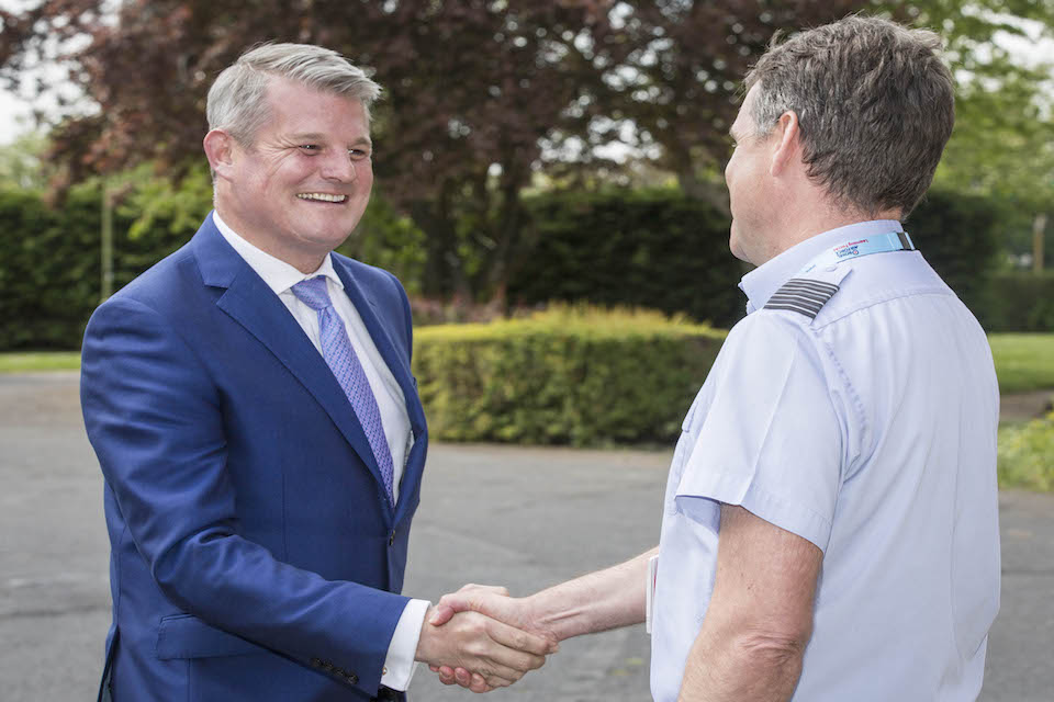 Defence Minister Stuart Andrew shaking hands with an RAF officer