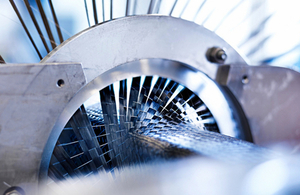A close-up of a carbon fibre weaving machine.