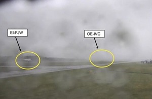 CCTV showing EI-FJW and OE-IVC over the runway