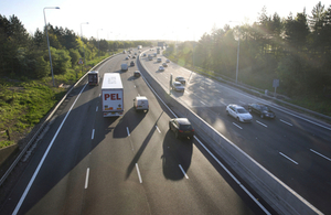 Picture of cars and trucks on road.