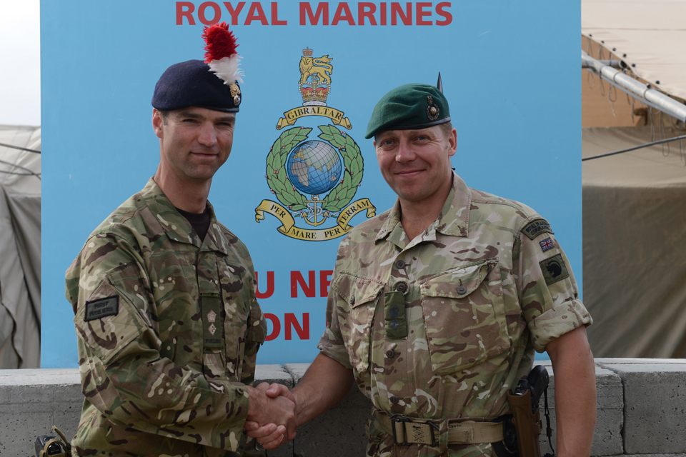 Lieutenant Colonel John Swift shakes hands with Lieutenant Colonel Matt Jackson