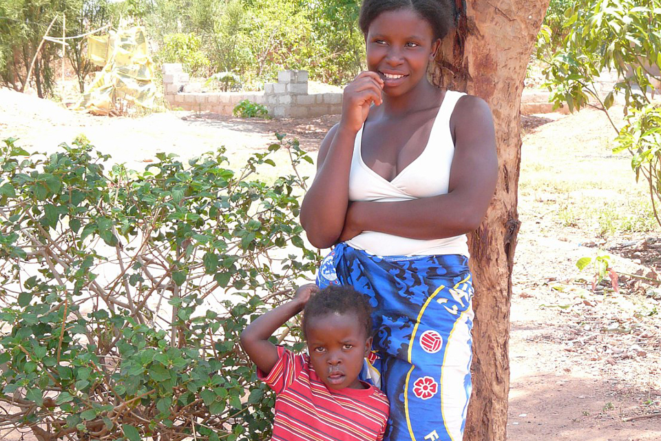 Mwenzi, 23, with one of her two children. Picture: International HIV/AIDS Alliance