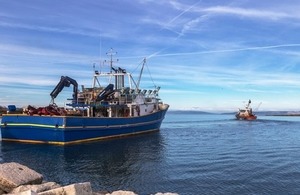 Two Fishing Trawlers at sea