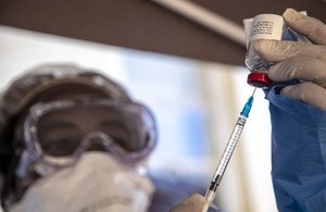 A medic in protective clothing prepares a dose of Ebola vaccine in the Democratic Republic of the Congo. Picture: UNICEF