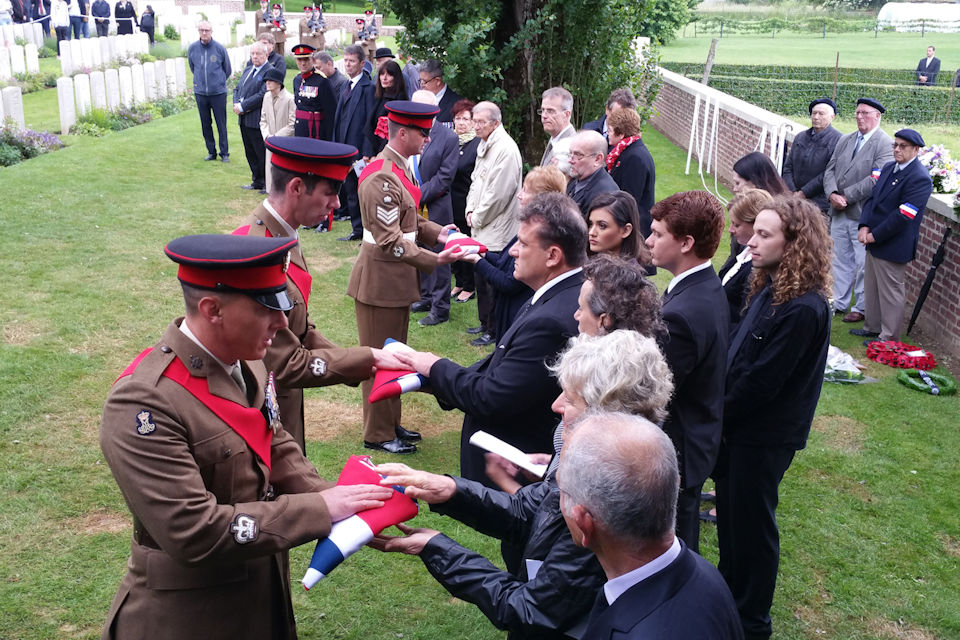 The 23rd Battalion present the Union Flags to the family, Crown Copyright, All rights reserved