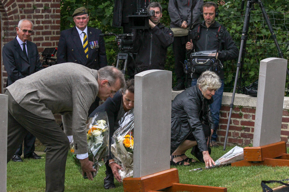 Family members lay flowers for their loved ones, Crown Copyright, All rights reserved