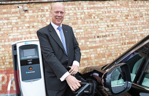 Chris Grayling with electric vehicle