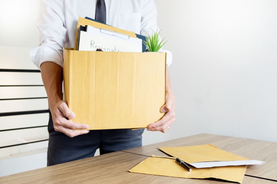 Man cleaing out desk