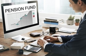 Man at computer showing pension fund