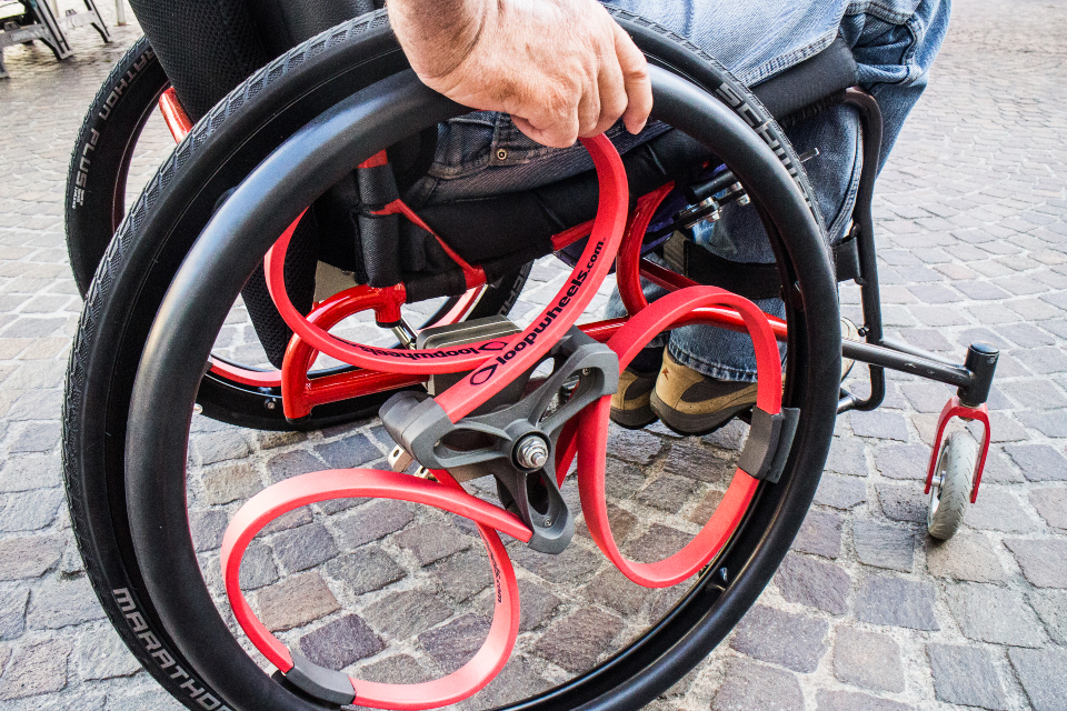 A close-up of a Loopwheels wheelchair wheel.