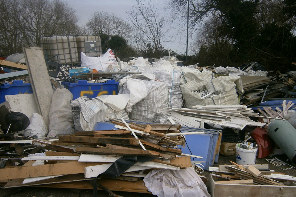 Piles of waste which were illegally stored at Fairfield Garage in Hilgay, Norfolk