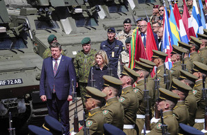 Defence Secretary Penny Mordaunt walks past troops