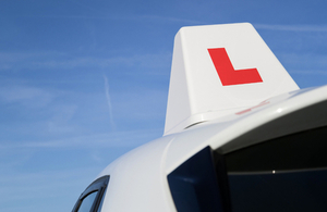 L plate on a driving school car