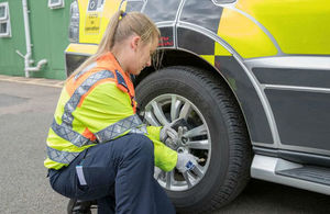 Traffic Officer Hannah Moffitt checks tyres on a Highways England vehicle