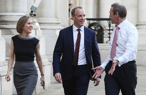 New Foreign Secretary Dominic Raab arriving at the Foreign and Commonwealth Office, alongside 2 of his civil servants