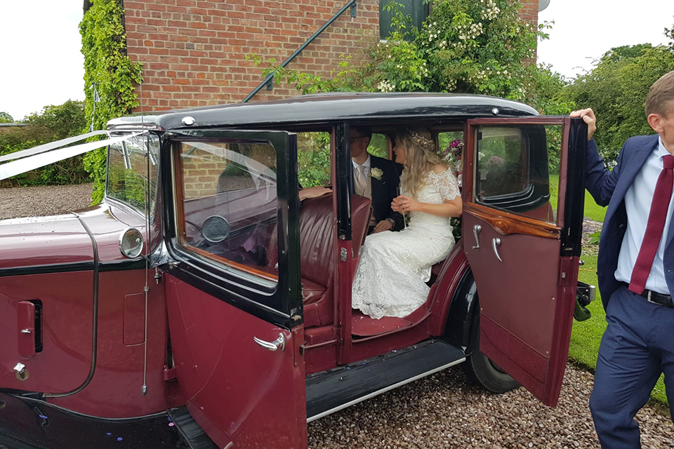 Newlyweds Oliver Daniels and Holly Johnson arriving at their wedding reception