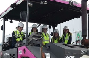 Students from William Howard School with a resurfacing paver and roller during their 'construction school' visit.