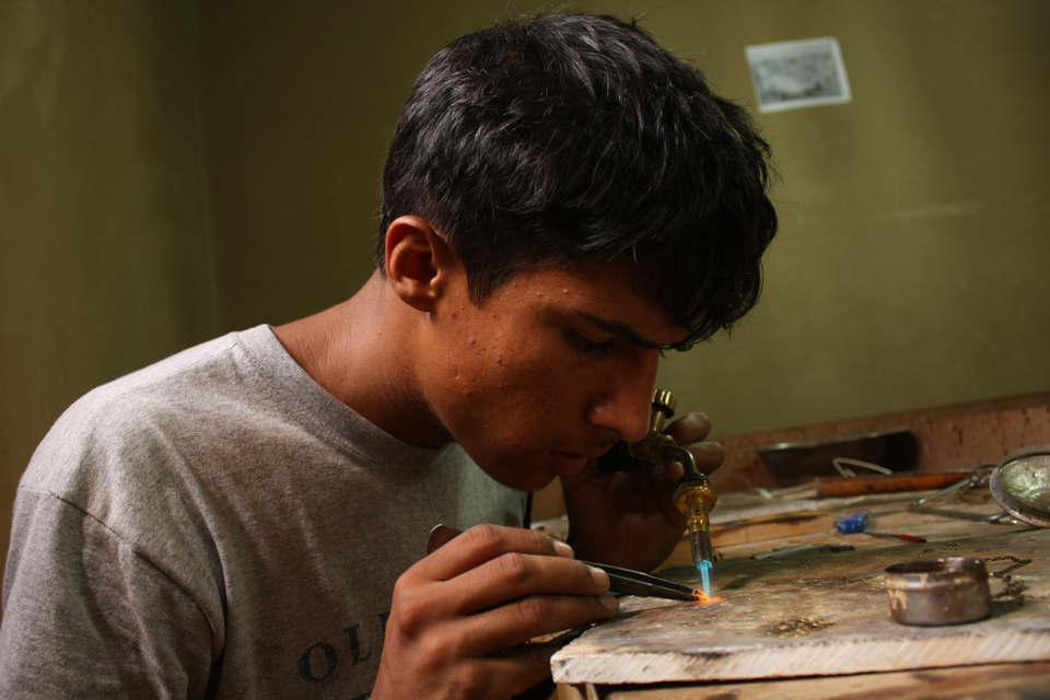 Mohammad at work in his workshop. Picture: Mohammad Humayoon Nawrozi/TMI