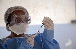 An Ebola vaccination team member prepares to administer the Ebola vaccine in the Democratic Republic of the Congo.