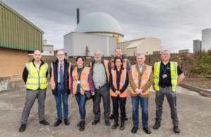 group of people standing at Dounreay site of Britain's former centre of nuclear fast reactor research and development is in the process of being demolished and cleaned up – radioactive waste was disposed there from 1959 until the late 1970s.