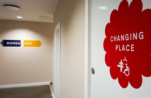 Corridor with signs for changing places facilities