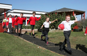 image showing Pupils trying out the new footpath created by road workers