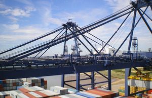 Port of Felixstowe, docks with cranes and cargo ship.