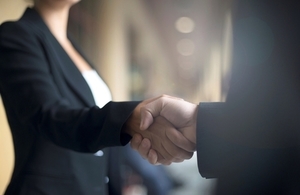 An image of two business people shaking hands