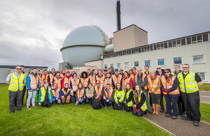 The international delegates are photographed in front of the Dounreay Fast Reactor, which is being decommissioned