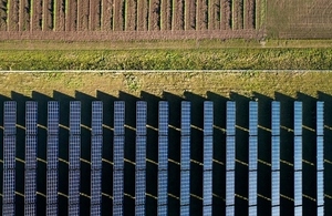field with rows of solar panels