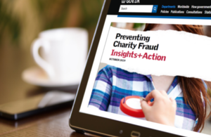 A computer screen displaying the front page of a research report about charity fraud.