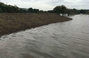 The photo shows the water lapping at the toe of the newly constructed defence at Harrow Drive, Branston