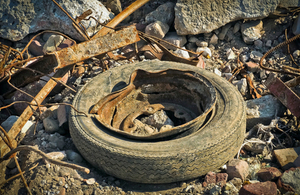 A rusty tire on the ground