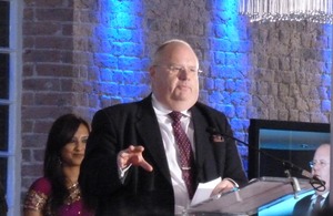 Eric Pickles at a podium