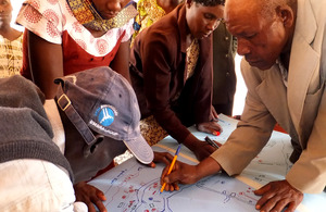 Beneficiaries of a cash transfer scheme on Kwakavisi community in Kenya undertaking a mapping exercise.