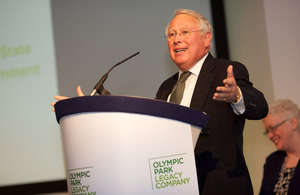 Bob Neill standing at a podium