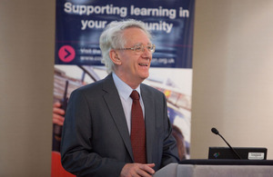 Andrew Stunell behind a podium