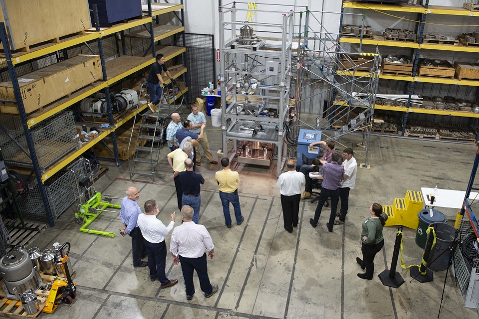 An overhead view of the HIP rig in America, with various observers standing around