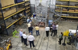 Observers at the can-filling demonstration rig in the US