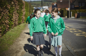 Children in uniform walking to school