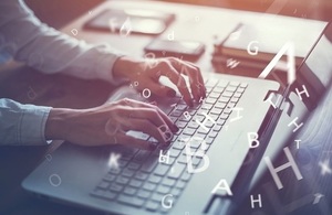 Woman Typing on Laptop